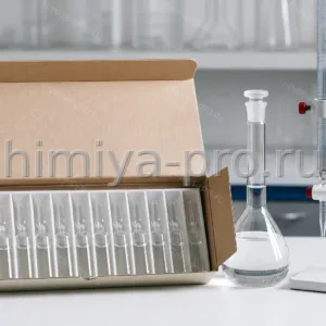 Коробка ампул бесцветного раствора аммония роданистого 0,1Н рядом с бюреткой для титрования серебра